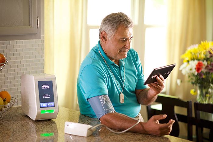 a man attached to a blood pressure monitor